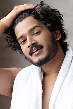 Model showcasing hair care essentials – White Wolf men’s grooming